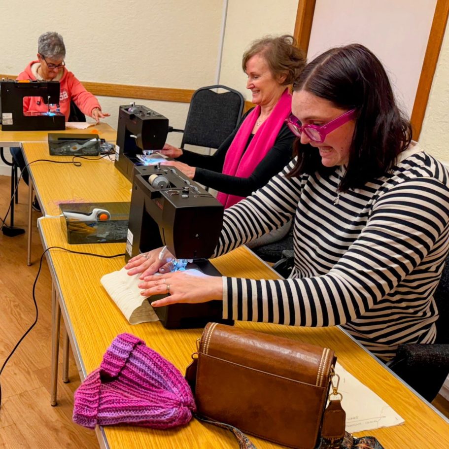 Members of Largs SWI Sewing Club learning and enjoying creative sewing projects together at the AD Cameron Centre.