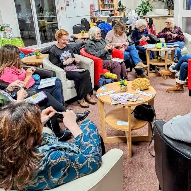 Members of Largs SWI Yarn Club enjoying knitting, crochet and conversation during a relaxed weekly club evening.