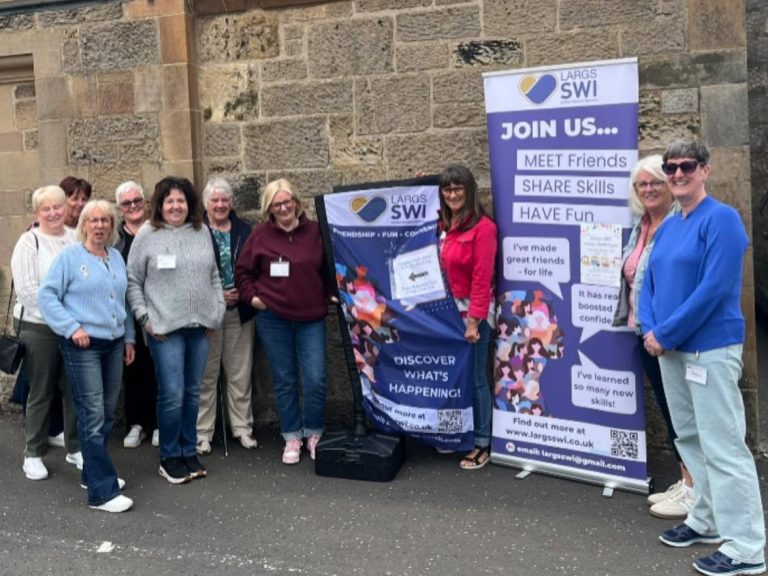 Members of Largs SWI volunteering at the Largs SWI Summer Craft Fair supporting women's community activities in Largs